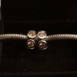 Two Pandora honey stone spacers